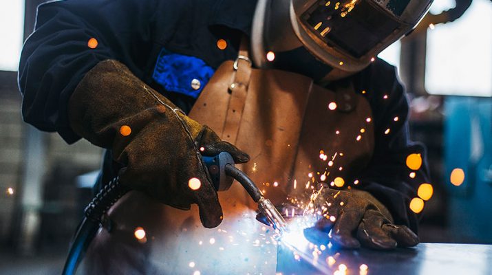man welding with mask