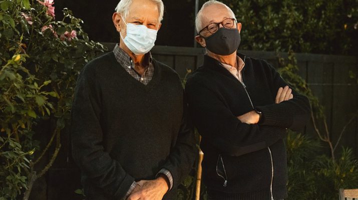 stanford economists standing with masks on